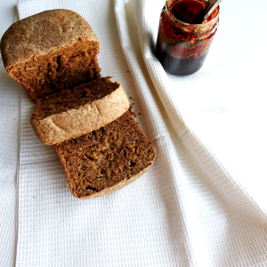 honey wheat bread with an open can of buckwheat honey